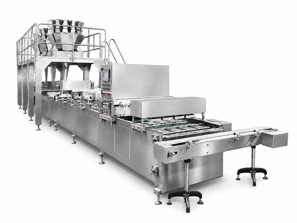 Tray sealing machine line for frozen food portions